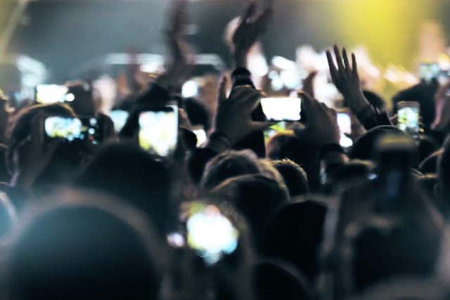 concert audience holding up phones