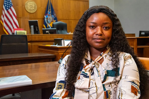 Tavione Griffin, seated in a courtroom at her internship.